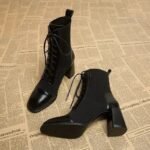 Slim black boots for women